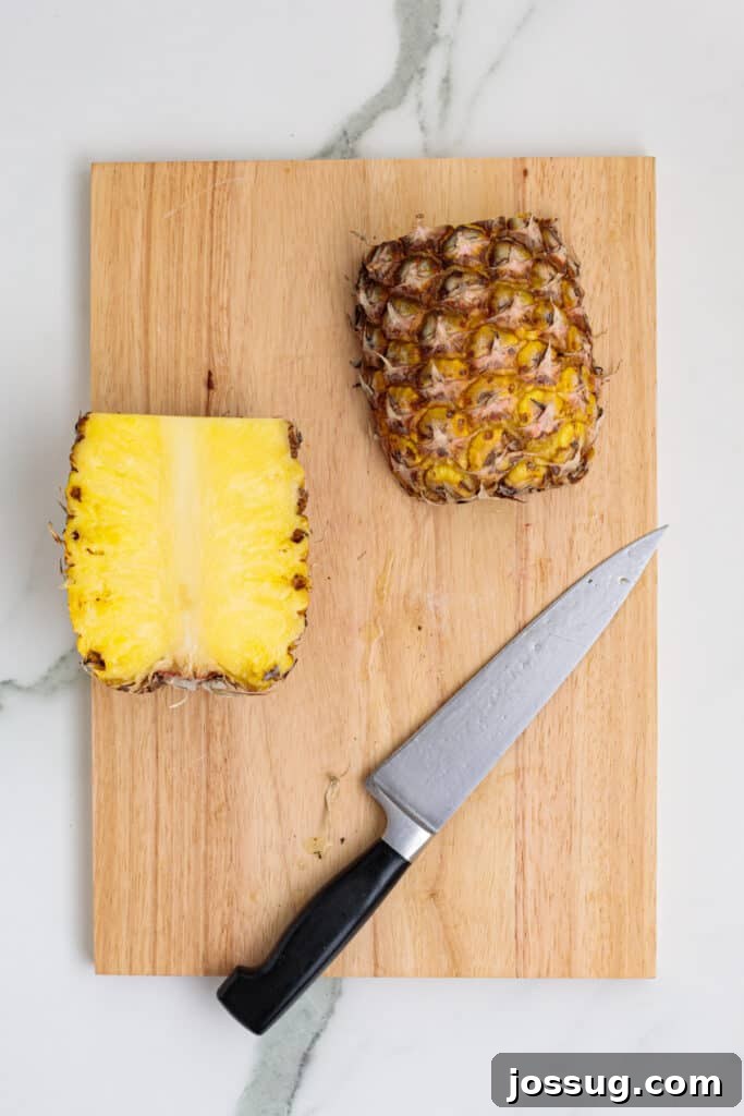 Pineapple cut in half showing juicy yellow interior