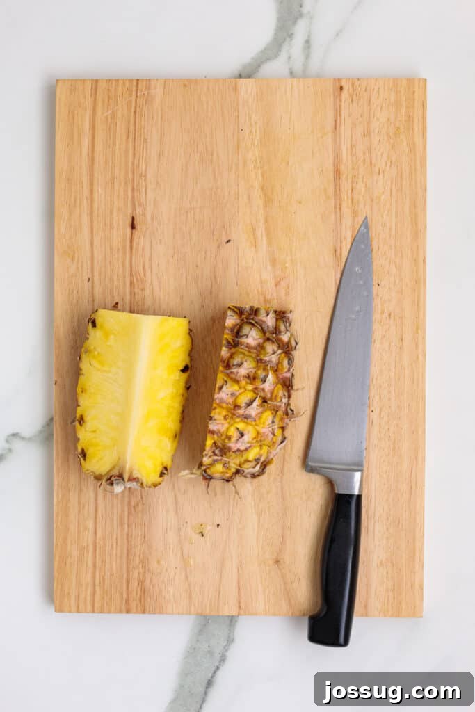 Pineapple cut into quarters, but showing 2 sections
