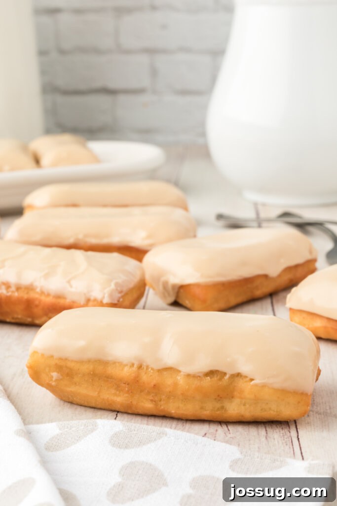 Golden Maple Treats 2 Golden-brown maple bars artfully arranged on a rustic wooden table, ready to be enjoyed.