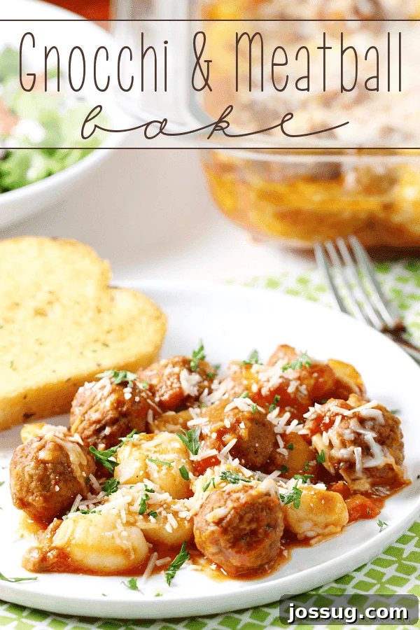 Gnocchi and Meatball Bake on a white plate with French bread and a fork.