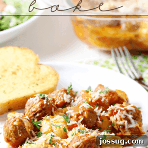 Gnocchi and Meatball Bake on a white plate with French bread and a fork.