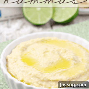 Tropical Hummus in a white bowl with a lime.