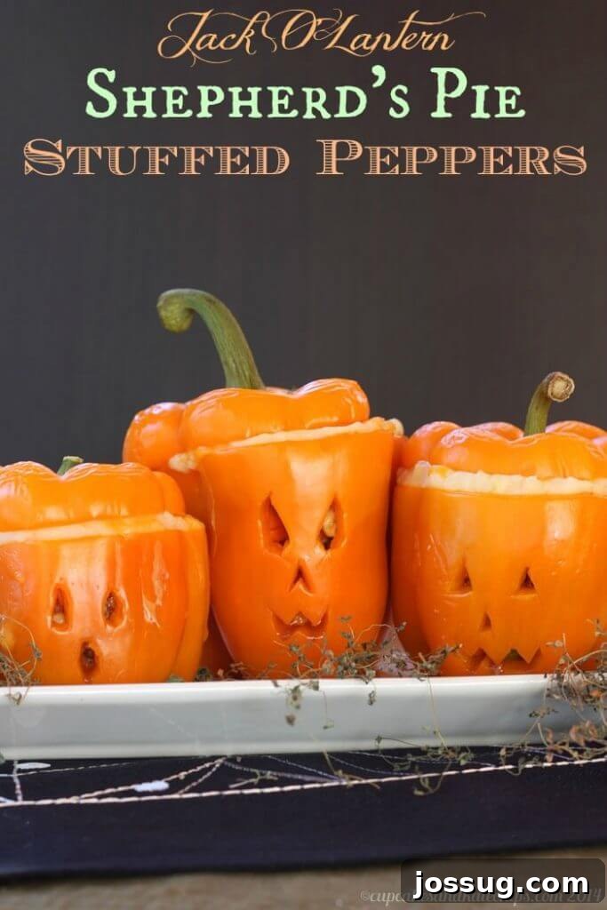 Colorful bell peppers carved into Jack O'Lantern faces, filled with savory Shepherd's Pie mix.