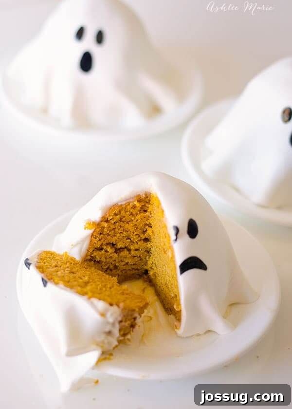Charming mini pumpkin ghost cakes served in small white bowls, looking like floating ghosts.