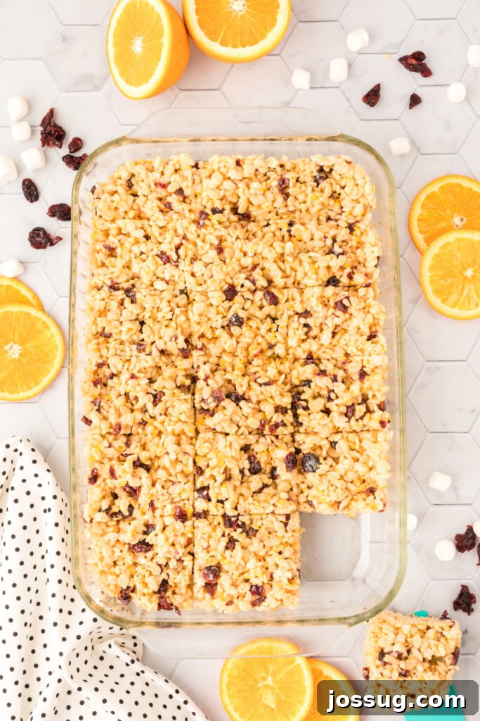 Sunshine Berry Crunch Bars 3 cranberry orange rice krispy treats mixture in a pan, ready to set