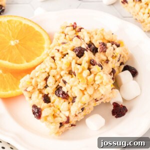 Sunshine Berry Crunch Bars 7 two cranberry orange rice crispy treats on white plate