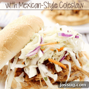 Chipotle Pulled Pork Sandwiches with Zesty Mexican Slaw 3 Chipotle Pulled Pork Sandwiches with Mexican-Style Coleslaw on a plate close up.