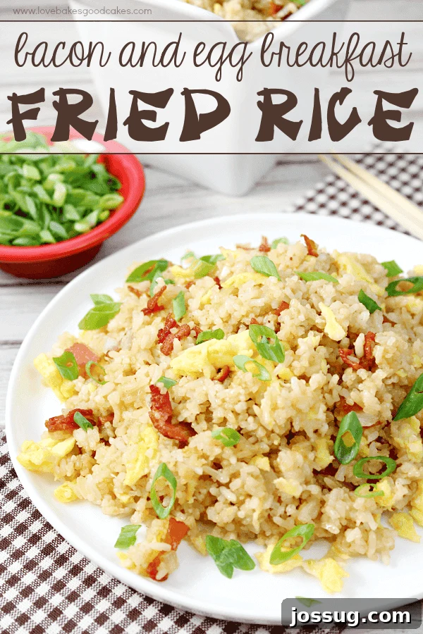 Hearty Bacon and Egg Breakfast Fried Rice 2 A serving of Bacon & Egg Breakfast Fried Rice garnished with green onions on a pristine white plate.