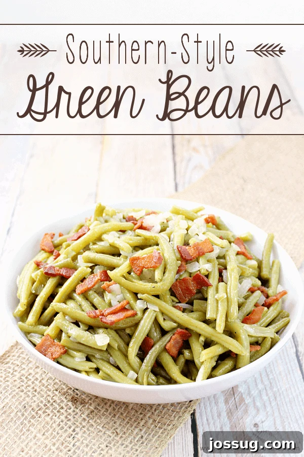 A white bowl filled with perfectly cooked Southern-Style Green Beans garnished with crispy bacon bits.