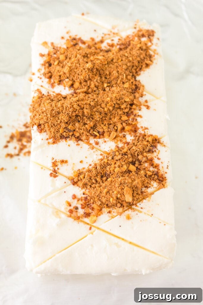 Scored cream cheese topped with a generous layer of BBQ rub