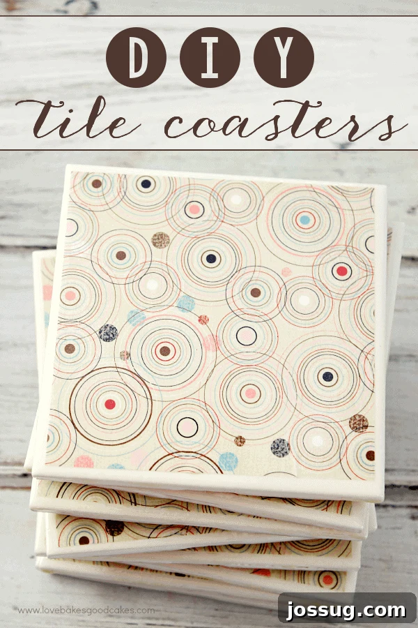 Stacked DIY tile coasters next to a cup of Bigelow tea, showcasing elegant decorative paper designs.