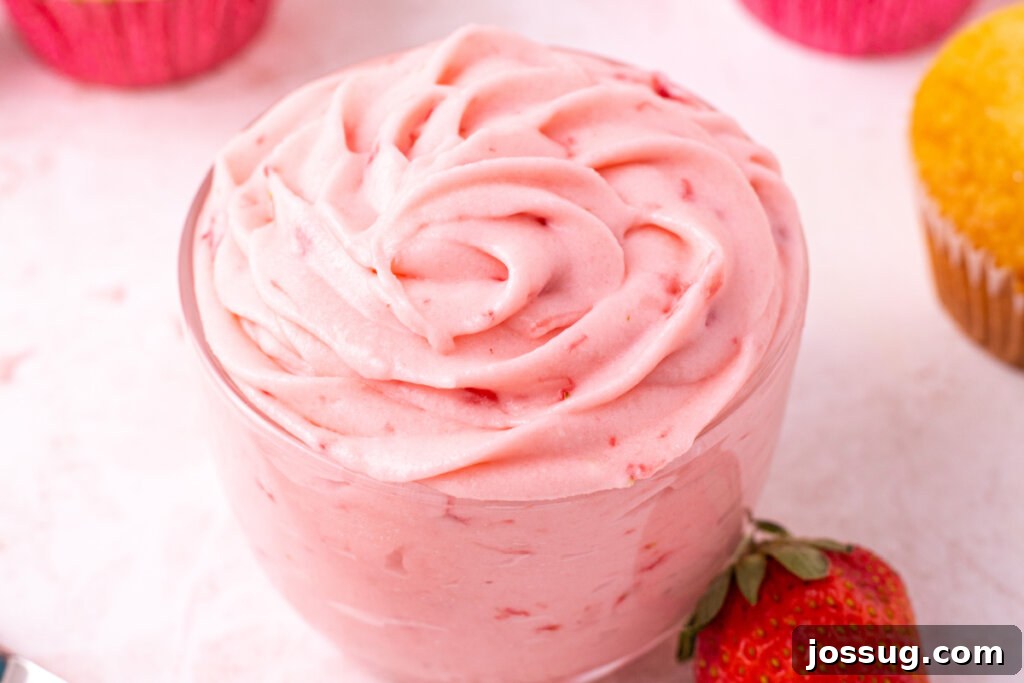 Velvet Strawberry Buttercream 6 A vibrant glass jar brimming with fresh strawberry buttercream frosting, ready to be used or served
