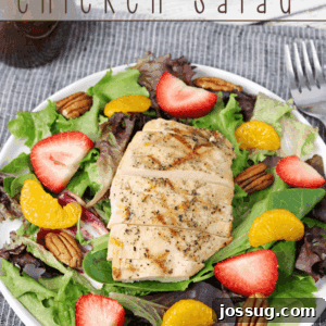 Another angle of the colorful California Chicken Salad in a bowl, highlighting the fresh fruit and grilled chicken.