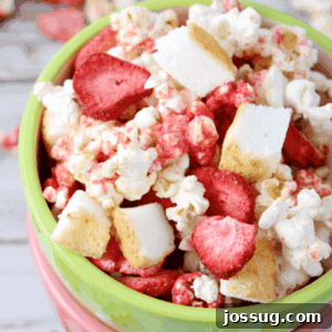 Strawberry Shortcake Popcorn in a green bowl.