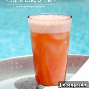 June Bug Drink in a glass by the pool, a perfect summer refresher.