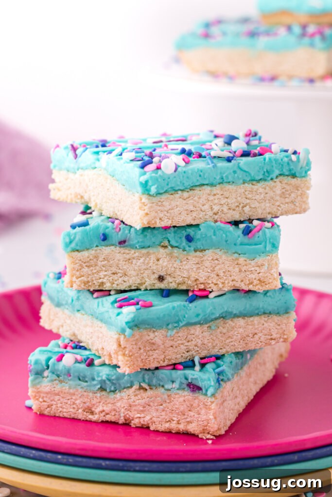 A plate of stacked sugar cookie bars.