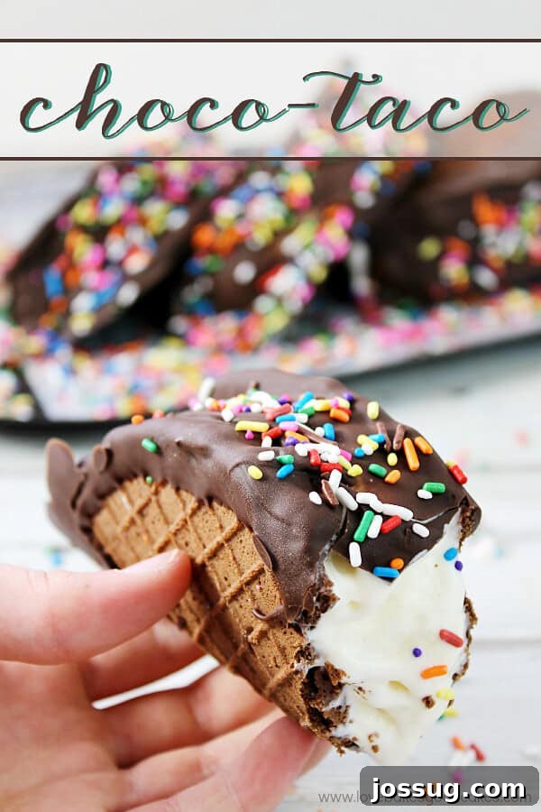 Choco Taco Bliss 2 A hand holding a homemade Choco-Taco with a bite taken out, showcasing the creamy ice cream and chocolate shell.