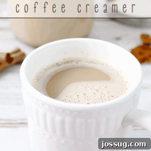 A cup of coffee in a white cup showing the top of the cup.