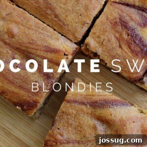 Decadent Chocolate Swirl Blondies 6 Chocolate Swirl Blondies cut into squares on a cutting board.
