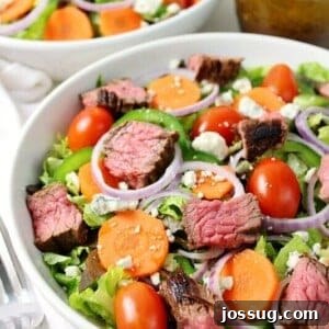 Steak and Blue Cheese Salad in a white bowl, ready to serve.
