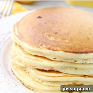 Lemon Berry Pancakes stacked on a plate.