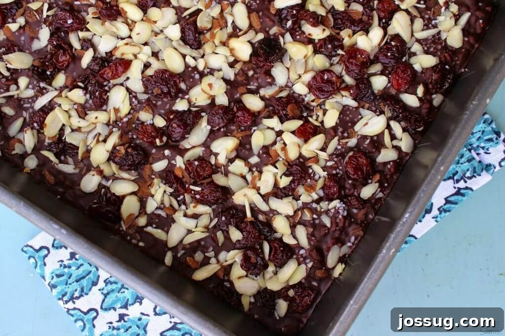 Decadent Dark Cherry Almond Crunch Bars 4 Crispy Dark Chocolate Cherry & Almond Bars arranged artistically, ready to be enjoyed.