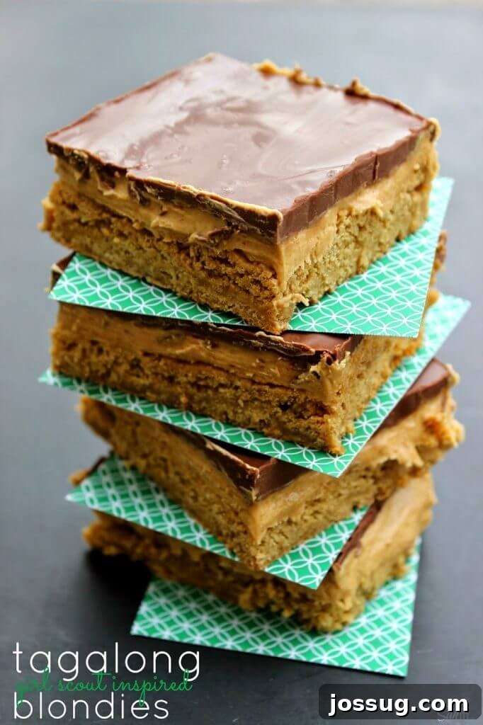 Decadent Dark Cherry Almond Crunch Bars 7 Tagalong Blondies stacked up while showing the side cross cut texture of the food.