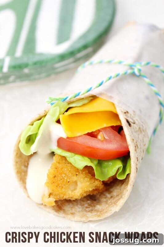 Crispy Chicken Snack Wraps: Golden chicken, fresh lettuce, tomatoes, and cheese in a soft tortilla.