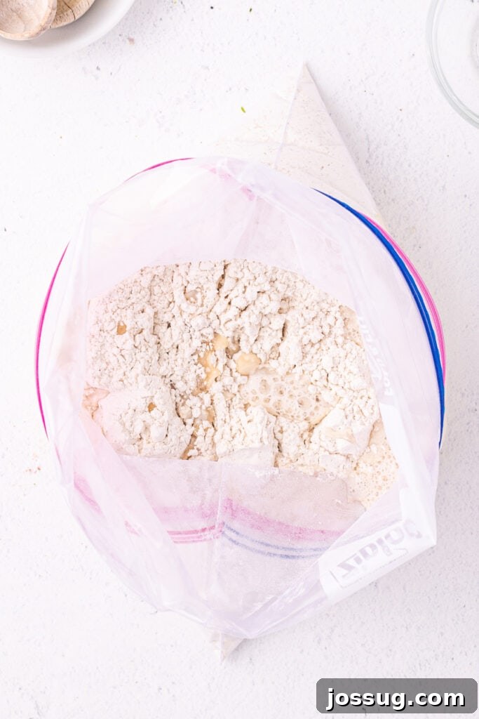 Warm water and oil added to flour mixture in a Ziploc bag