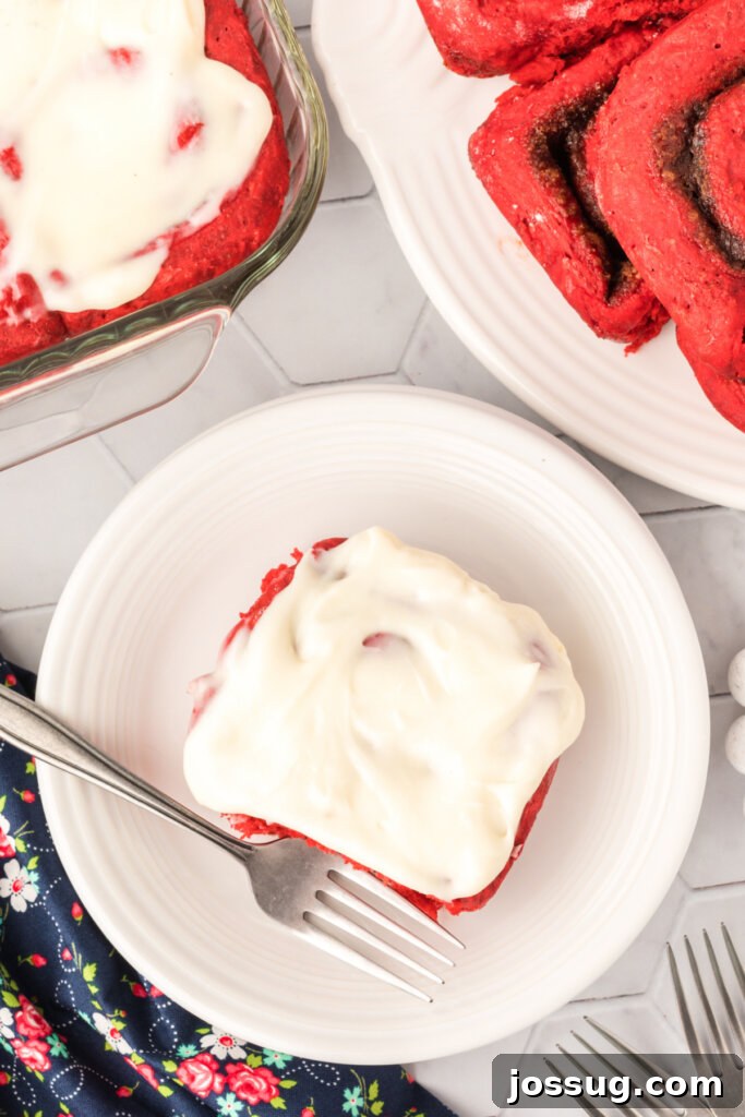 looking down onto a red velvet cinnamon roll on plate