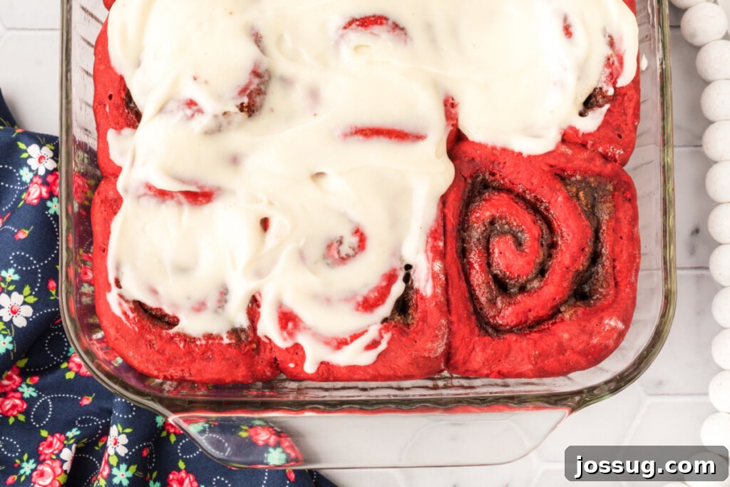 red velvet cinnamon rolls in pan