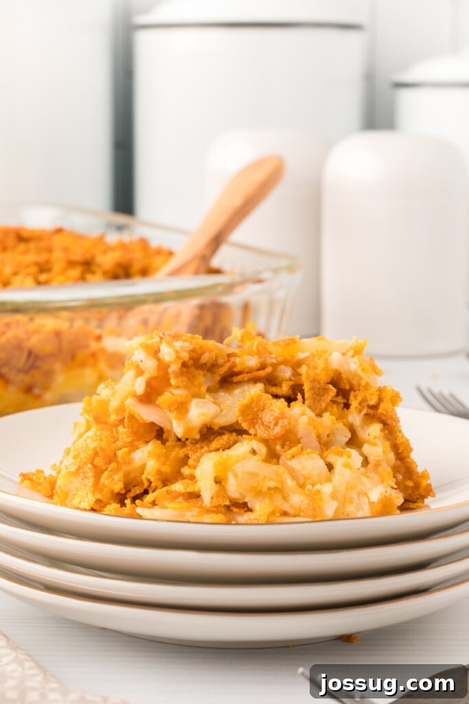 Potato casserole served on stacked plates at a gathering