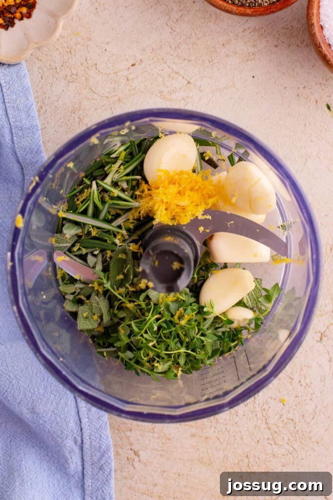 Crispy Porchetta Perfection 5 Garlic, rosemary, thyme, sage, and lemon zest in a food processor bowl