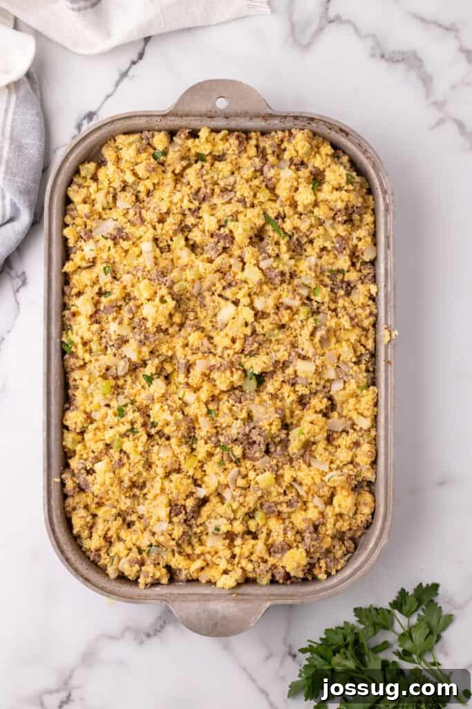 Homestyle Cornbread Dressing 9 Baking dish filled with uncooked cornbread dressing mixture spread evenly and ready for the oven.