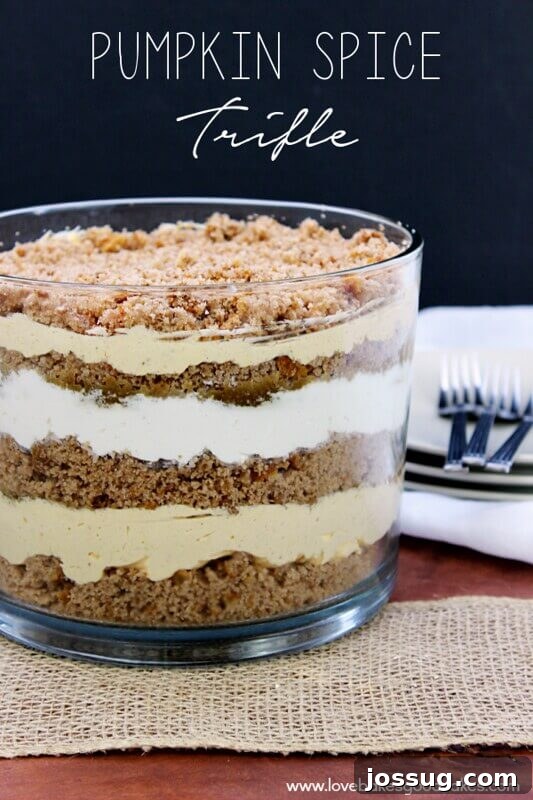 A beautifully layered pumpkin trifle in a clear glass bowl, ready for serving.