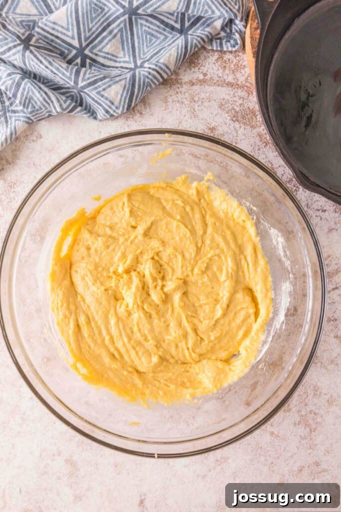 Cultured Cornbread 13 Mixing bowl filled with smooth sourdough cornbread batter, ready to be transferred to skillet.