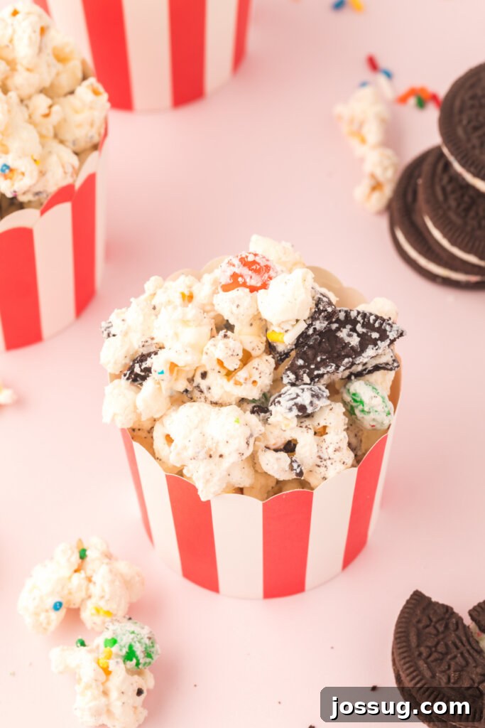 Funfetti Popcorn Treat 3 small red and white striped party cup filled with birthday cake popcorn mix