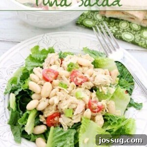 Mediterranean Tuna Salad on a white plate with a fork.
