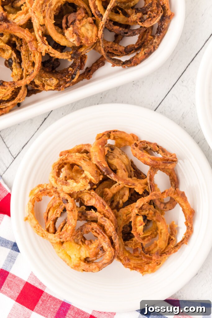 Golden Crispy Onion Rings 3 onion rings on plate
