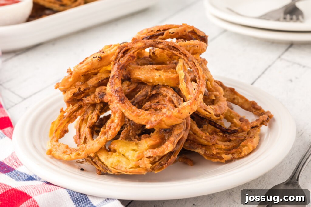 Golden Crispy Onion Rings 5 onion rings on plate
