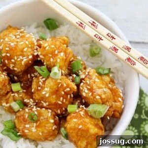 Crispy Orange Chicken served with fluffy rice.