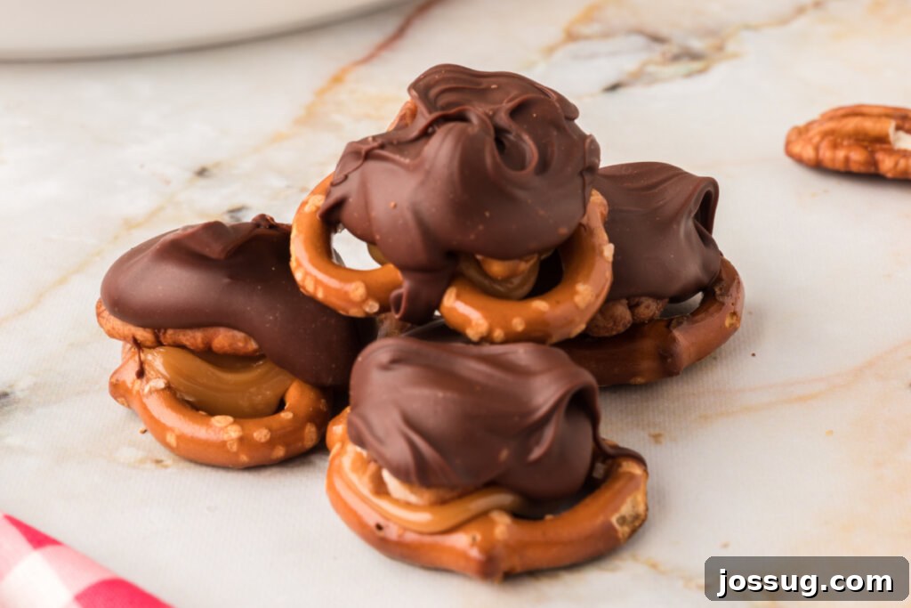 Gooey Caramel Pecan Turtles 6 A warm, inviting shot of chocolate turtle candies arranged on a wooden table, emphasizing their homemade goodness.