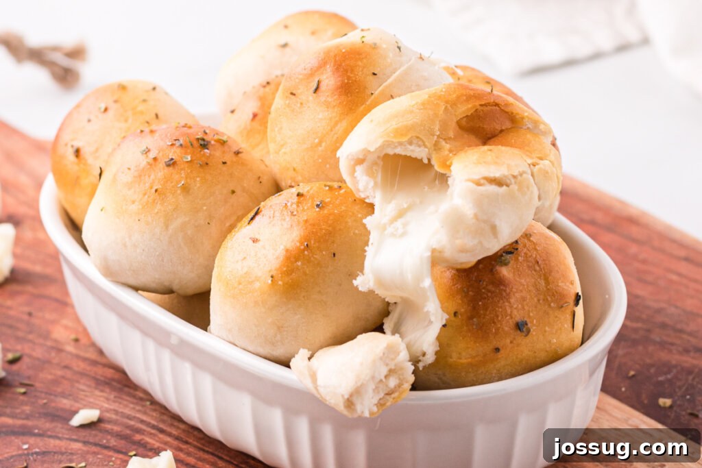 Cheesy Garlic Herb Melt-Aways 6 garlic herb cheese bombs stacked in platter