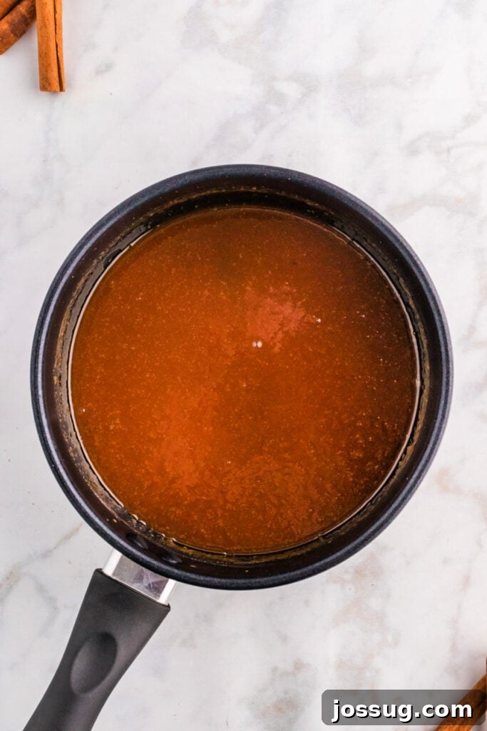 A saucepan filled with smooth, perfectly finished spiced caramel sauce, gently cooling and ready to be served.