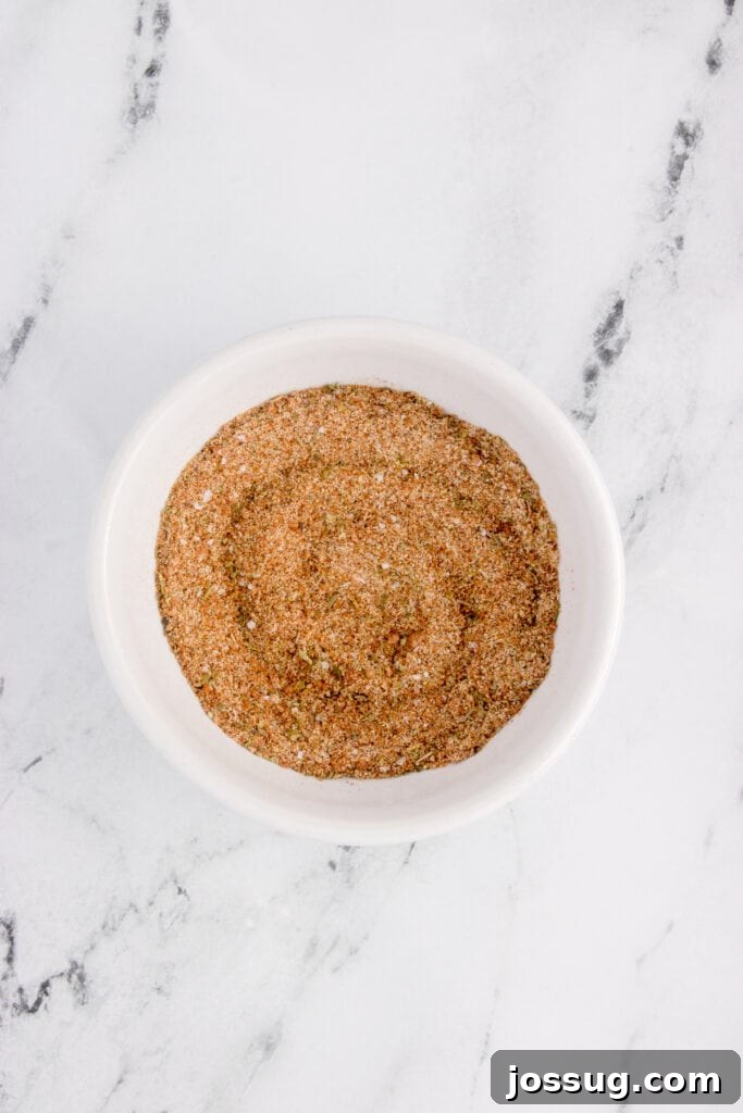 Mixed blackened salmon seasoning blend in a small white bowl.
