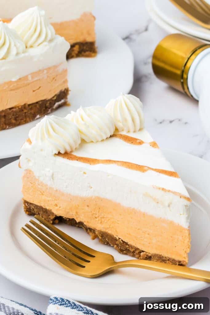 Decadent No-Bake RumChata Pumpkin Cheesecake 2 Slice of no bake RumChata pumpkin cheesecake on a white plate with a gold fork, showing creamy pumpkin and RumChata layers.