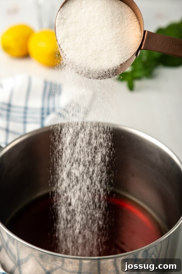 Southern Sweet Tea: Always Smooth and Sweet 7 sugar being poured into brewed tea