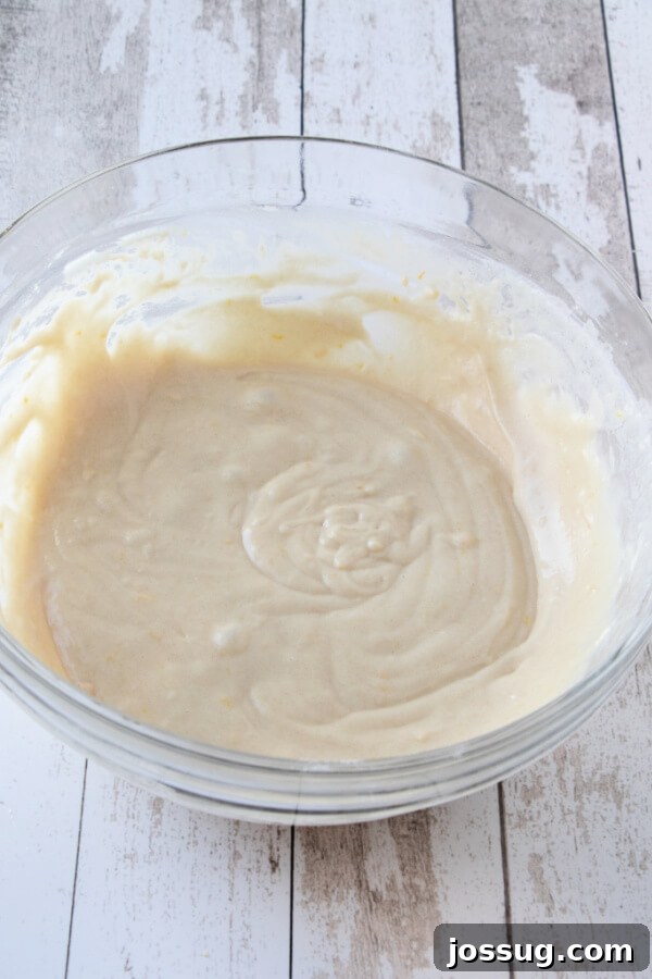 The smoothly mixed batter in a bowl, ready for the streusel topping.