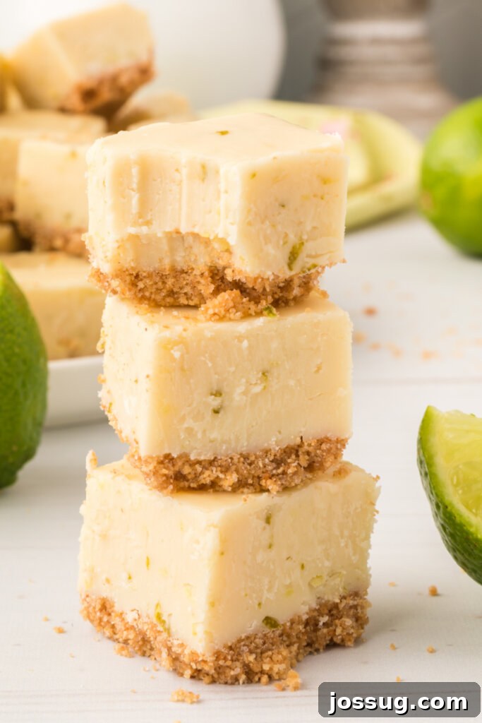 Three creamy, zesty key lime pie fudge squares stacked elegantly, showcasing their vibrant color and smooth texture