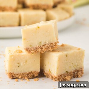 Three pieces of creamy key lime pie fudge stacked in a triangle shape